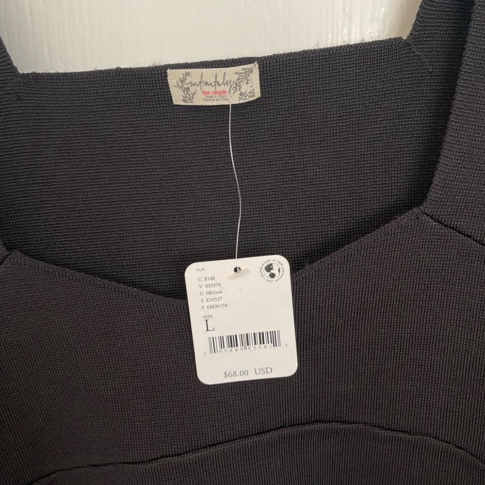 Black top , long sleeve with butterfly